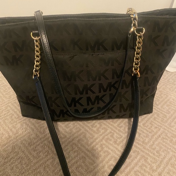Black Michael Kors purse. Great size. Used with some normal wear and tear. - Picture 1 of 5